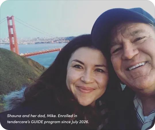 A caregiver and their loved one smiling outdoors